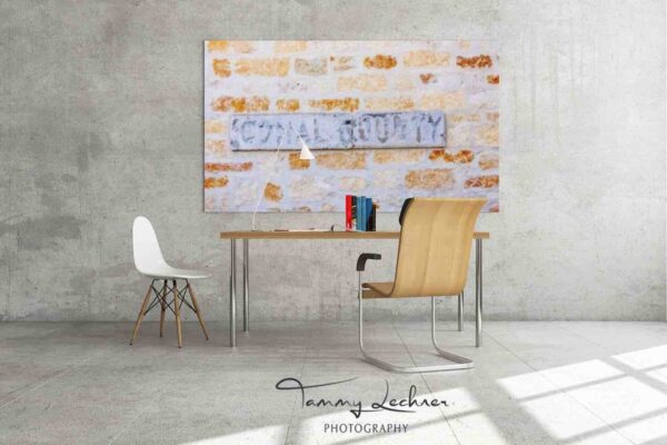 mockup-Comal County metal plaque on Limestone